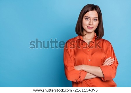 Portrait of attractive cheery content skilled girl agent broker folded arms copy blank space isolated over bright blue color background