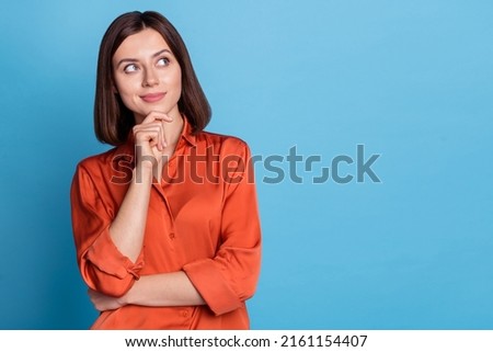 Portrait of attractive minded skilled girl real estate agent broker thinking copy blank space isolated over bright blue color background