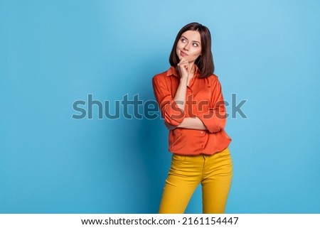 Photo of young pretty woman thoughtful minded look empty space plan isolated over blue color background Royalty-Free Stock Photo #2161154447