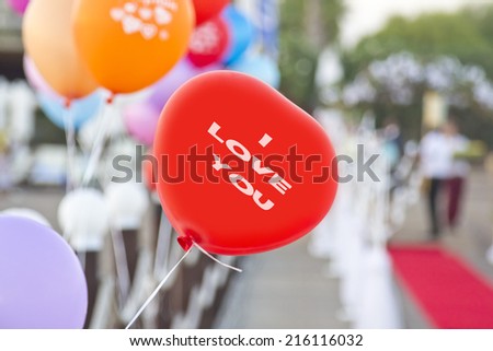 Red balloon with "i love you" writing on it