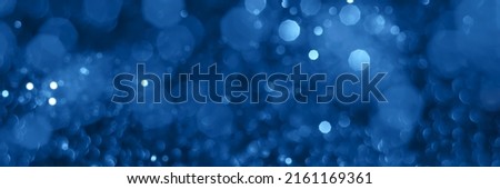 Blue sparkling glitter bokeh background texture. Holiday blurred lights. Abstract defocused header. Wide screen wallpaper. Panoramic web banner with copy space for design