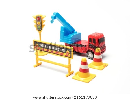 under construction sign toy on white background