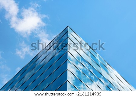 Office buildingfacade. Close up of a modern glass building Royalty-Free Stock Photo #2161214935