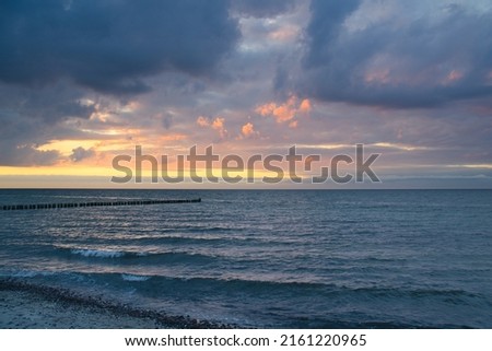 Sunset on the Baltic Sea. Sea, bean strong colors. Vacation on the beach. Romantic mood on the darss. Landscape photo.