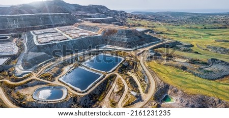 Copper ore solvent extraction at Skouriotissa mine in Cyprus. Leaching heaps and storage reservoirs  Royalty-Free Stock Photo #2161231235