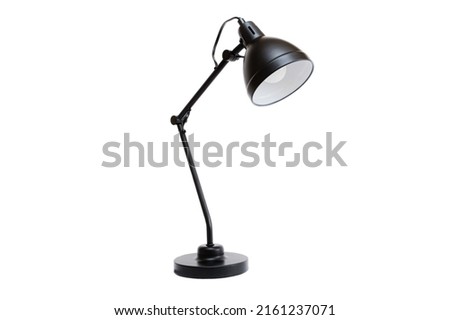 Black lamp on a white background. Front side view. Modern Scandinavian style desk lamp. Minimalistic interior decoration object. Royalty-Free Stock Photo #2161237071