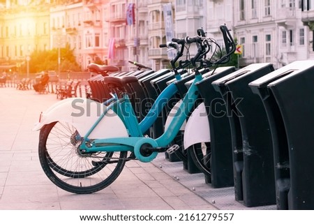 Bicycles available to hire by the public, rent a bike service in istanbul, bicycles parked on a bicycle stand. Royalty-Free Stock Photo #2161279557