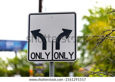 Left turn only right turn only sign