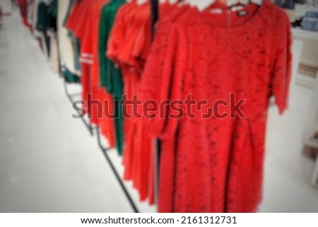 Defocused abstract background of 
Shades of red on women's clothing counters. Located in a mall in Jakarta, Indonesia.
