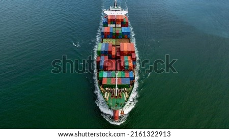 Container ship leaving the industrial seaport, Global business Import export, Company business logistic and transportation international by container cargo freight ship in the open sea. Royalty-Free Stock Photo #2161322913