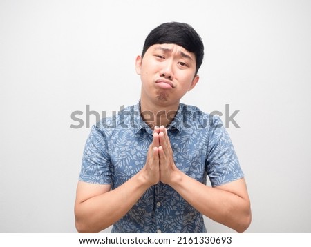 Man blue shirt gesture respect hand need help please Royalty-Free Stock Photo #2161330693