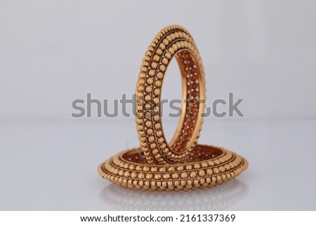 Golden Bangles set for women and Girls ,Heavy weight Bengal set   Royalty-Free Stock Photo #2161337369