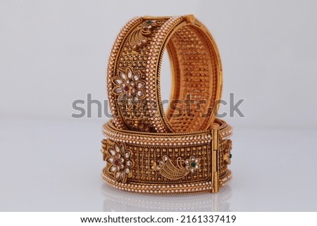 Golden Bangles set for women and Girls ,Heavy weight Bengal set   Royalty-Free Stock Photo #2161337419