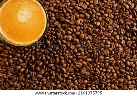 Cup Espresso On Roasted Coffee Beans Background.