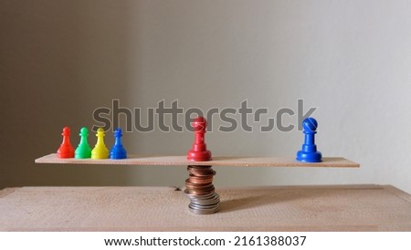 colored chess pawns. business concept, board game pieces and dices. Royalty-Free Stock Photo #2161388037
