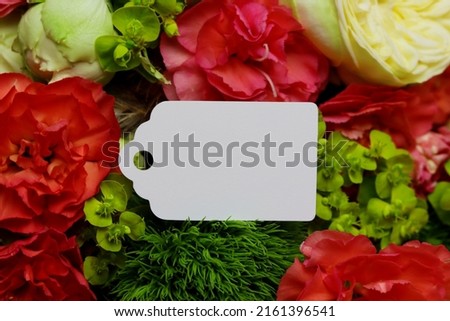 Label mockup with flowers, label mockup on floral background, clothing label floral mock-up