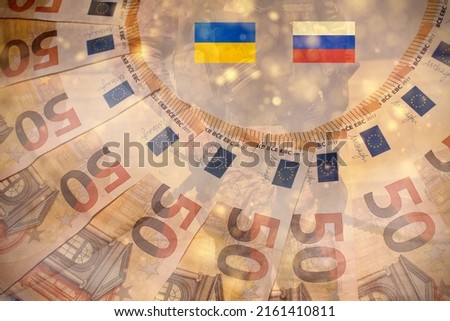 Ukrainian flag and Russian flag with money and military background .