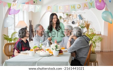 Group of Asian senior people having birthday party at home, celebrating birthday at retirement home with friends Royalty-Free Stock Photo #2161441021