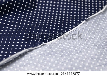 Mauled navy-colored fabric texture background. This fabric is made of 100% cotton.