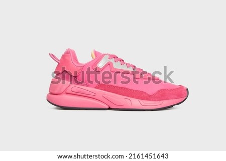 Pink women's basketball sneaker with high sole. Female sports shoe, boot isolated on white background. Footwear, casual leather training shoe. Template, mock up Royalty-Free Stock Photo #2161451643