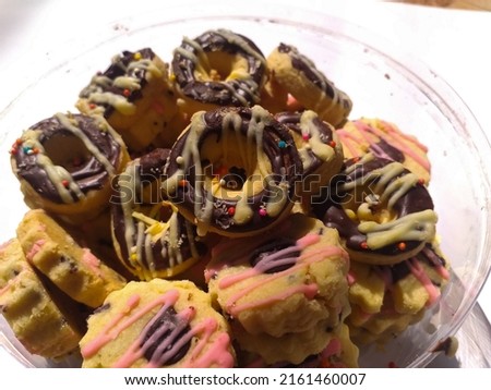 Cookies in tops with colorful chocolate topping