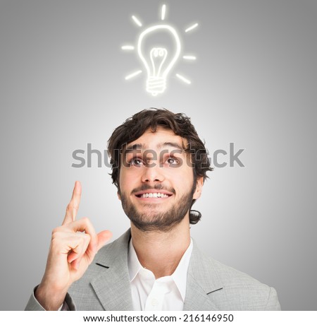 Young smiling man having a good idea Royalty-Free Stock Photo #216146950