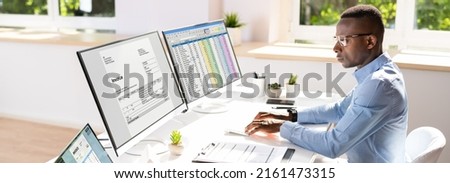 African American Accountant Using Electronic Invoice Software