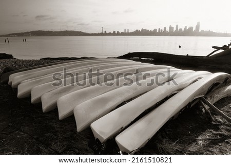 Seattle city view with urban architecture and canoe.