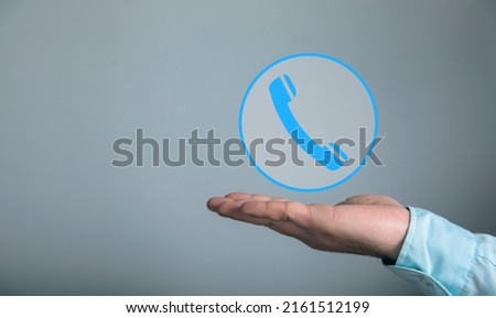 Handset icon in a circle. Man holding in his hand