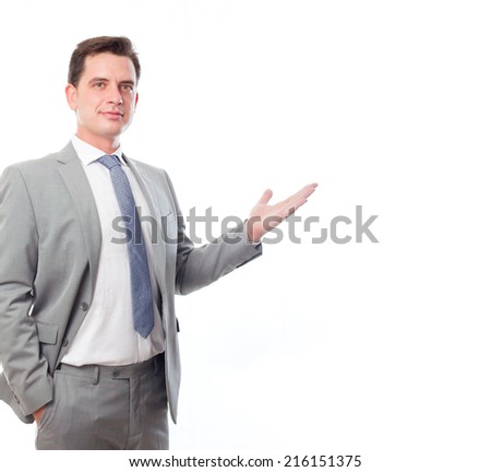Young business man over white background. Showing something