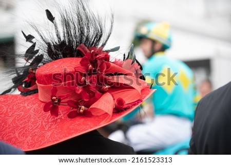 Elegant hats at a horse race  Royalty-Free Stock Photo #2161523313