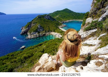 Traveler girl enjoying landscape from Porto Timoni Viewpoint in Corfu, Greece Royalty-Free Stock Photo #2161528745