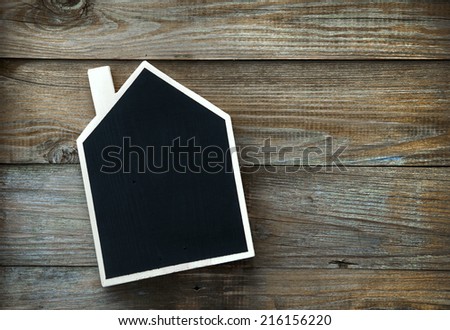 House Shaped Chalkboard sign  on rustic wood with place for text