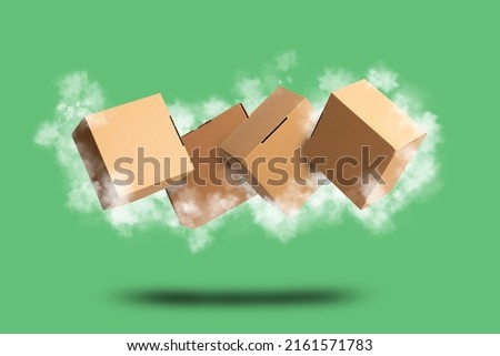 Brown Carton Cardboard box flying with clouds on green background