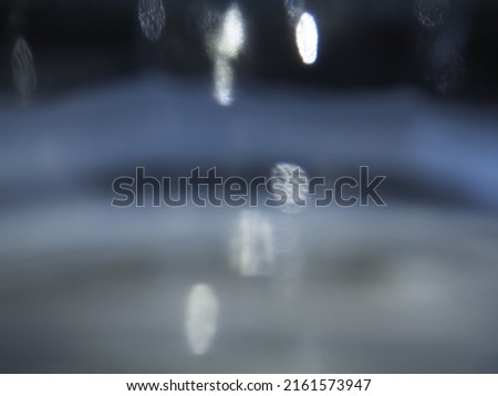 Silver blurred glitter reflection for abstract background.