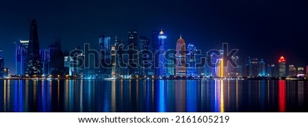 Doha, Qatar- May 5,2022 : Doha skyline with many towers during the night.