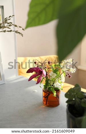 Bouquet with magnolia in a vase on the table