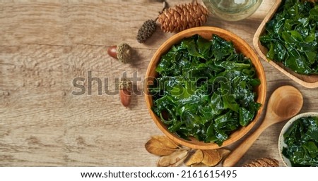top view or flay lay laminaria (Kelp) seaweed in a bowl on wood background with copy space                                                                                                              Royalty-Free Stock Photo #2161615495