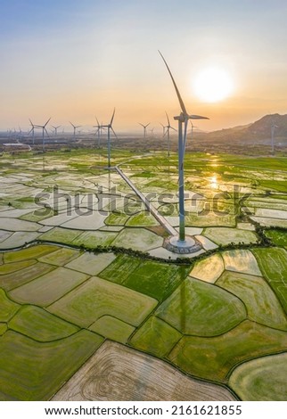PANORAMIC VIEW OF WIND FARM OR WIND PARK, WITH HIGH WIND TURBINES FOR GENERATION ELECTRICITY WITH COPY SPACE. GREEN ENERGY CONCEPT. NINH THUAN, VIETNAM Royalty-Free Stock Photo #2161621855