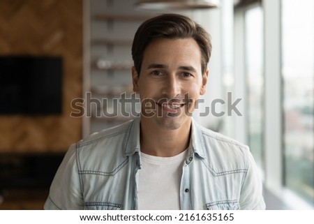 Profile picture of happy startup project leader, entrepreneur, self employed professional, office employee, millennial businessman. Male manager smiling at camera. Head shot portrait