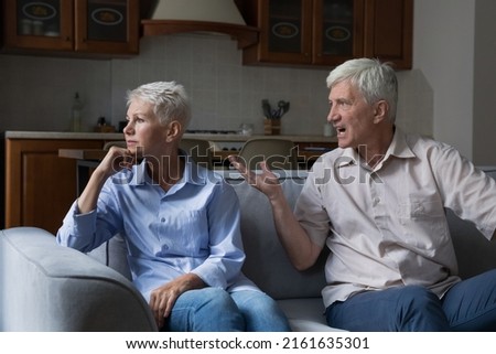 Psychological violence. Mature family couple come through marriage crisis relationship problems. Angry irritated jealous old age husband abuser yell scold stressed upset senior wife control her life Royalty-Free Stock Photo #2161635301