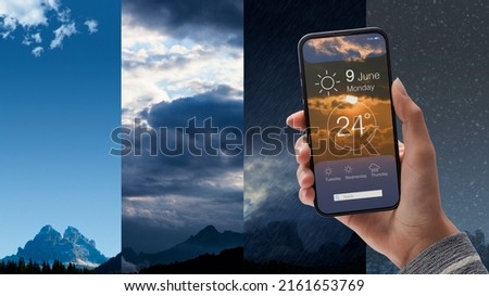 Hand holding a smartphone with weather forecast app on the display, different types of weather condition in the background, POV shot