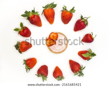 Strawberry background. Strawberry dessert time. The berries are laid out in the shape of a circle