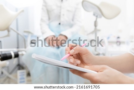 Young woman patient at gynecologist appointment consults in medical institution. Royalty-Free Stock Photo #2161691705