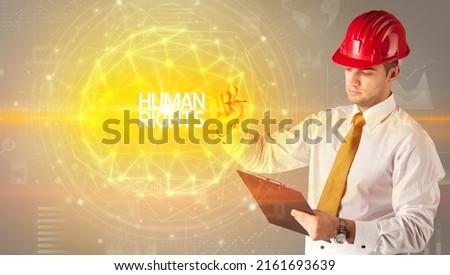 Handsome businessman with helmet drawing