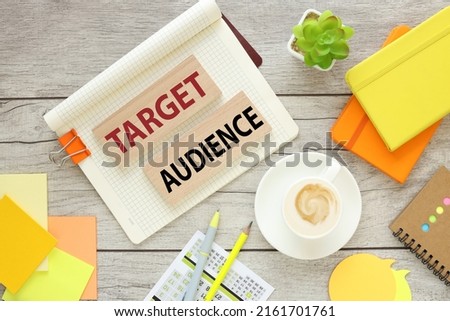 cup with coffee bright stickers, top view, wooden blocks with text. TARGET AUDIENCE Royalty-Free Stock Photo #2161701761