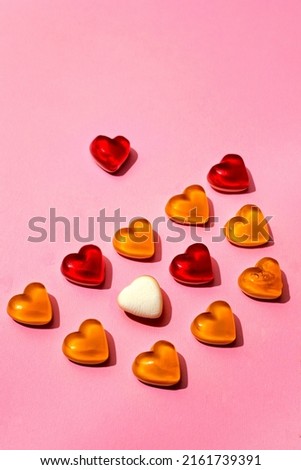 Gummy bears and hearts on Pink background
