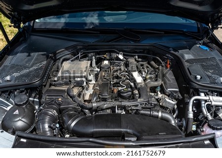 A modern diesel engine with 170 horsepower and an engine capacity of 2.2 liters. Visible engine equipment, spark plugs and electric wires. Royalty-Free Stock Photo #2161752679