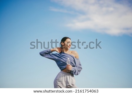 Cute girl training on a sky backgroung