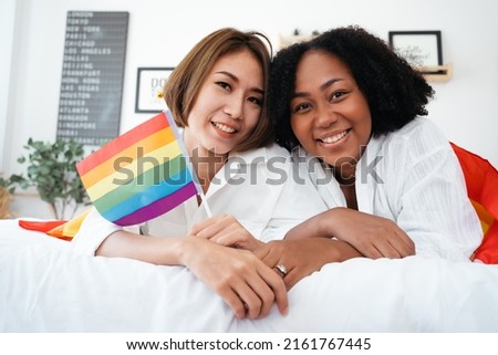 Diversity African American and Asian Married couples Lesbian LGBTQ. Married homosexual show Diamond ring.Sexual equality,LGBT Pride month,Parade celebrations concept.Family of happiness smiling. Royalty-Free Stock Photo #2161767445